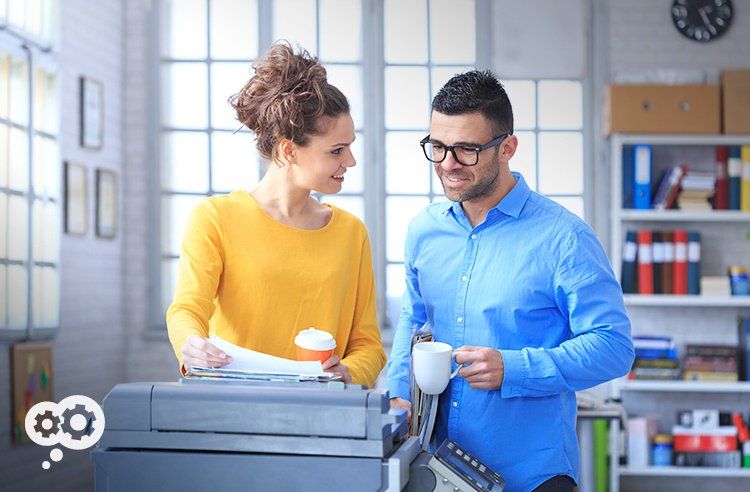 Forget the water cooler...everyone these days is gossiping around the digital copier instead.